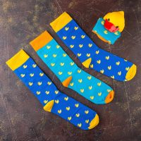 Blue socks with a pattern of yellow ducks